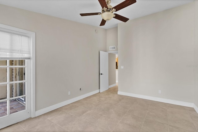 empty room with light tile patterned flooring and ceiling fan