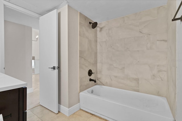 bathroom featuring vanity, tile patterned floors, and tiled shower / bath