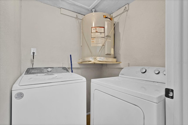 clothes washing area with separate washer and dryer