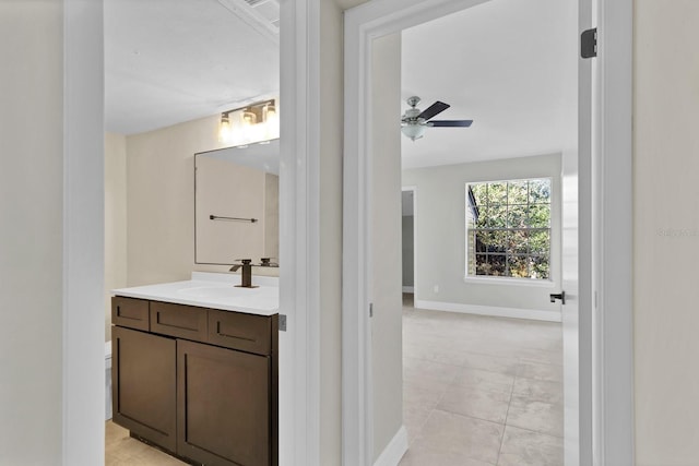 bathroom with vanity, tile patterned flooring, and ceiling fan