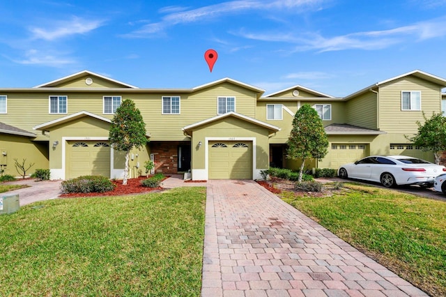 view of front of home with a garage and a front yard