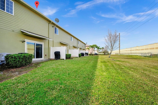 view of yard with central AC unit