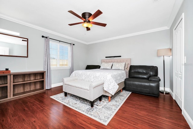 bedroom with crown molding, ceiling fan, and dark hardwood / wood-style floors