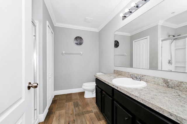 bathroom featuring a shower with door, wood-type flooring, ornamental molding, and vanity