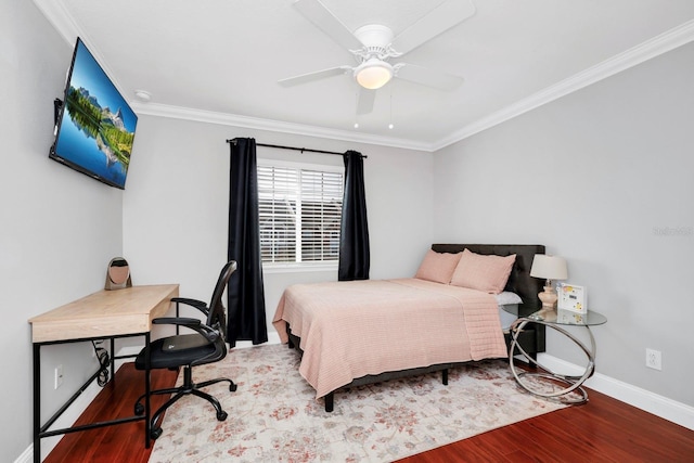 bedroom featuring crown molding, wood-type flooring, and ceiling fan