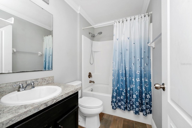 full bathroom with hardwood / wood-style flooring, ornamental molding, vanity, toilet, and shower / bath combo with shower curtain