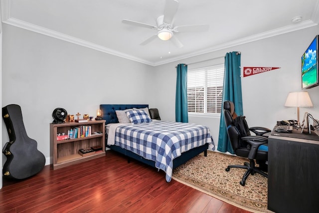 bedroom featuring dark wood-type flooring, ceiling fan, and ornamental molding