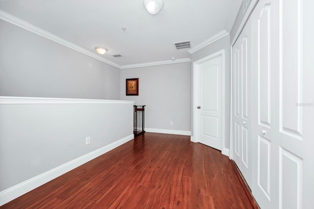 unfurnished room with crown molding and dark hardwood / wood-style floors