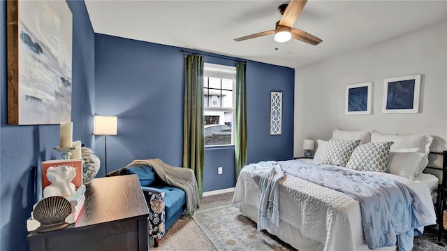 bedroom with light colored carpet and ceiling fan