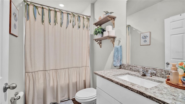 full bathroom with vanity, toilet, and shower / bath combo