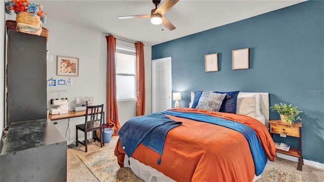 bedroom featuring light colored carpet and ceiling fan