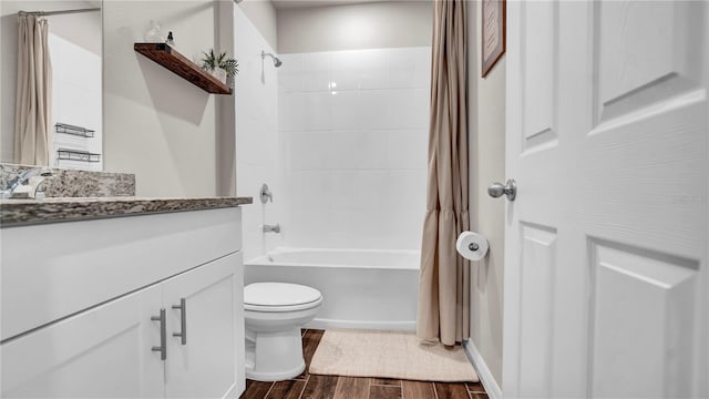 full bathroom featuring vanity, wood-type flooring, toilet, and shower / bathtub combination with curtain