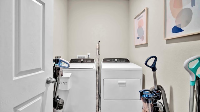 clothes washing area with independent washer and dryer