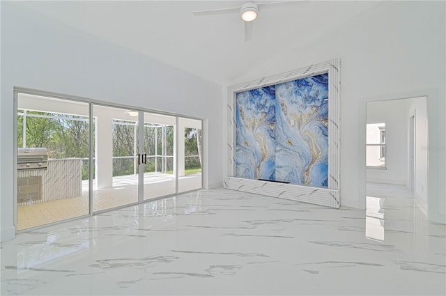 empty room featuring lofted ceiling, french doors, and ceiling fan