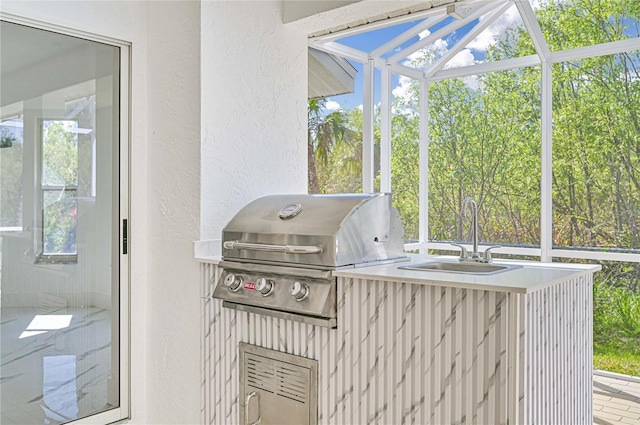 sunroom / solarium featuring sink