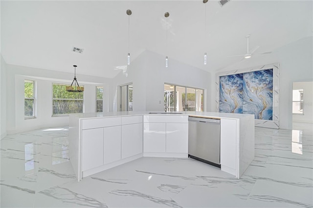 kitchen featuring sink, decorative light fixtures, dishwasher, a healthy amount of sunlight, and white cabinets