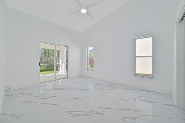 empty room featuring ceiling fan and high vaulted ceiling