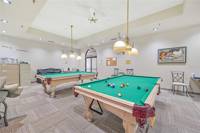 recreation room featuring light carpet, pool table, and a tray ceiling