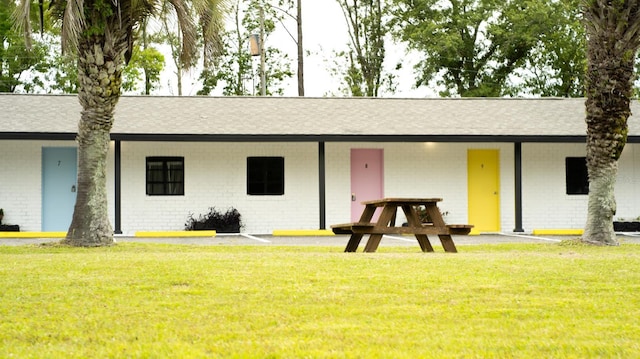 ranch-style house with a front lawn