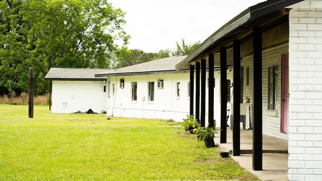 view of home's exterior featuring a yard