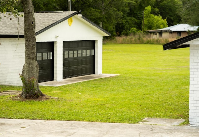 exterior space featuring an outdoor structure and a lawn