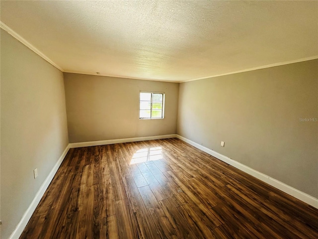 unfurnished room featuring ornamental molding, dark hardwood / wood-style floors, and a textured ceiling