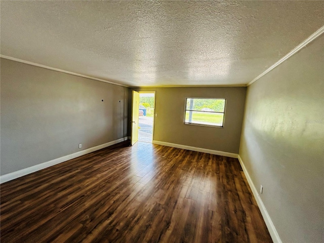 empty room with crown molding, dark hardwood / wood-style floors, and a textured ceiling