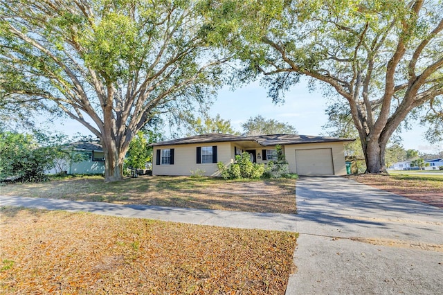 ranch-style home with a garage