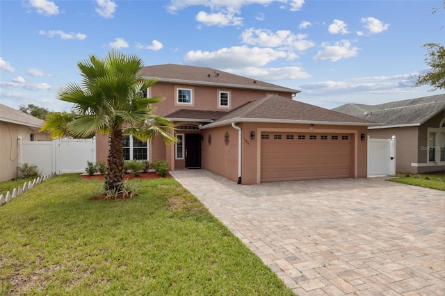 view of front of house featuring a garage and a front yard