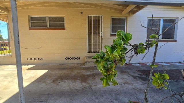 doorway to property with a patio