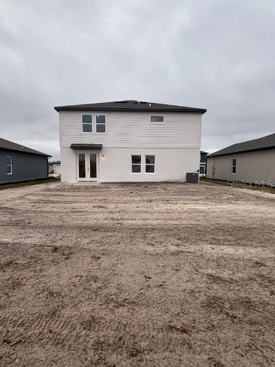 back of house featuring central AC