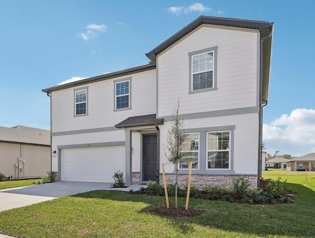 view of front of home featuring driveway, stone siding, an attached garage, and a front lawn