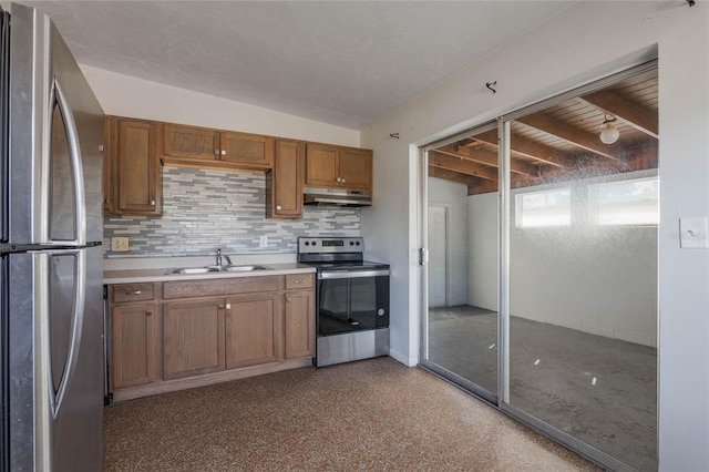 kitchen with sink, a textured ceiling, beamed ceiling, stainless steel appliances, and decorative backsplash