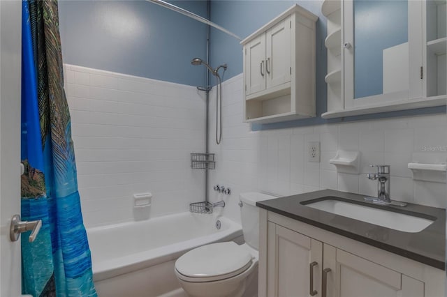 full bathroom with shower / tub combo with curtain, toilet, tile walls, vanity, and backsplash