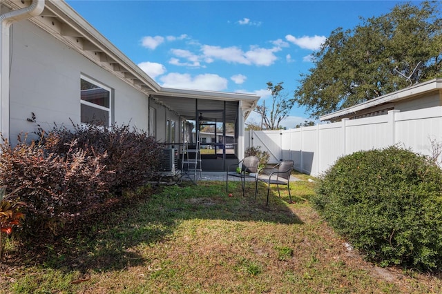 view of yard with a sunroom