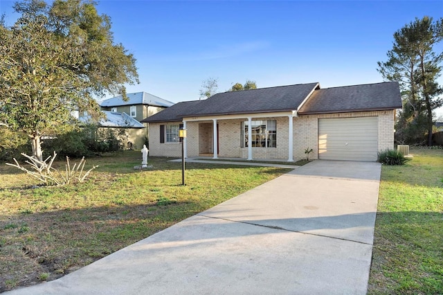 view of front of property with a garage and a front yard