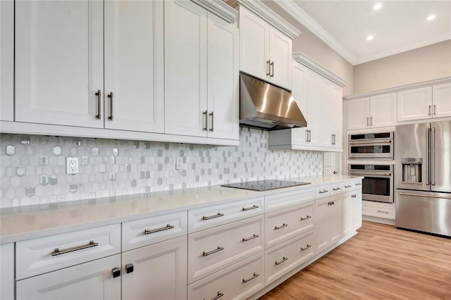 kitchen with crown molding, tasteful backsplash, light stone counters, stainless steel appliances, and white cabinets