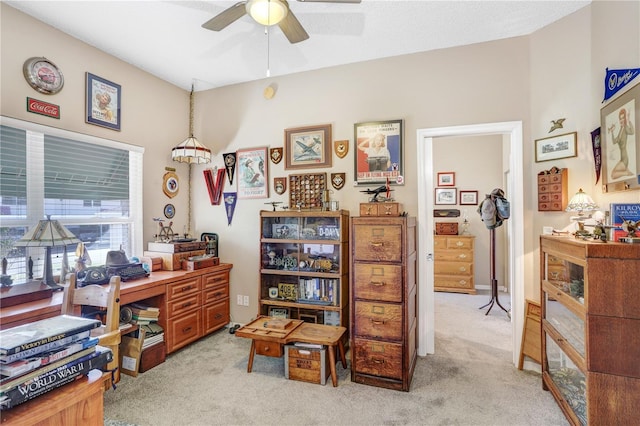 carpeted office with ceiling fan