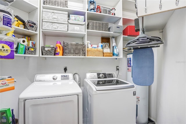 laundry area with cabinets and washing machine and clothes dryer