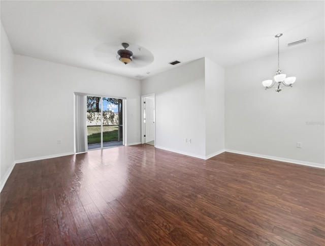 unfurnished room featuring dark hardwood / wood-style floors and ceiling fan with notable chandelier