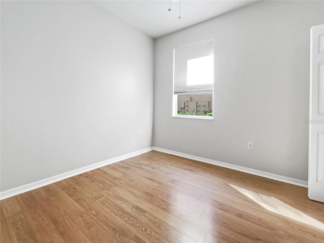 spare room with light hardwood / wood-style floors and ceiling fan