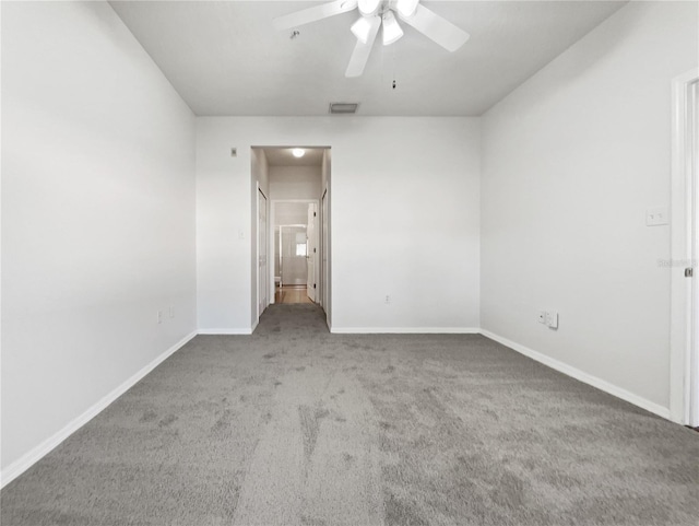 unfurnished bedroom featuring connected bathroom, carpet floors, and ceiling fan