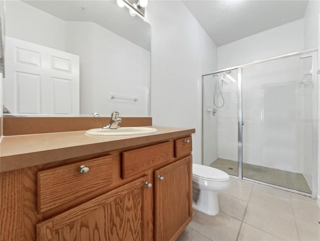 bathroom featuring vanity, an enclosed shower, tile patterned floors, and toilet