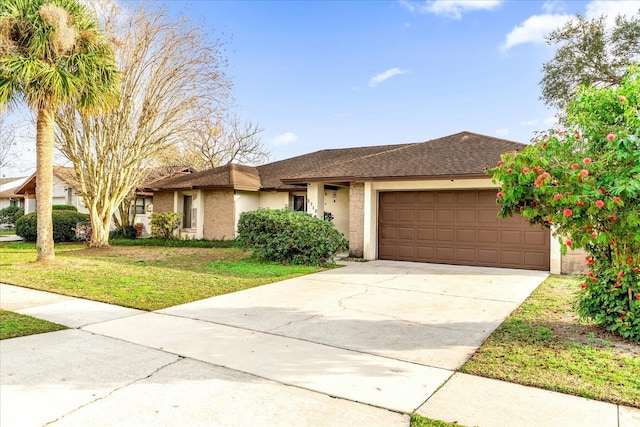 ranch-style home with a garage and a front lawn