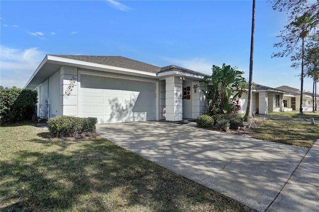 ranch-style home with a garage and a front yard