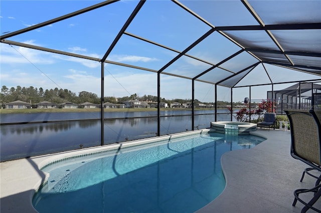 view of pool with an in ground hot tub, a water view, a lanai, and a patio