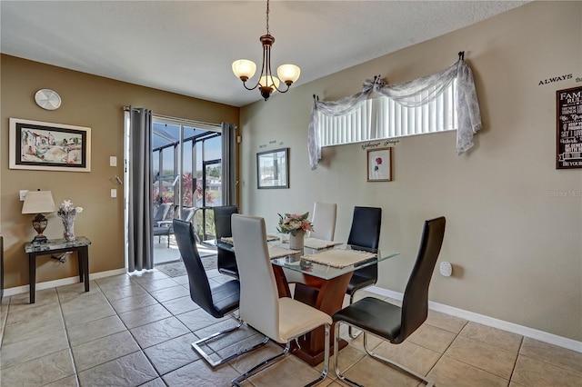 tiled dining area featuring a notable chandelier