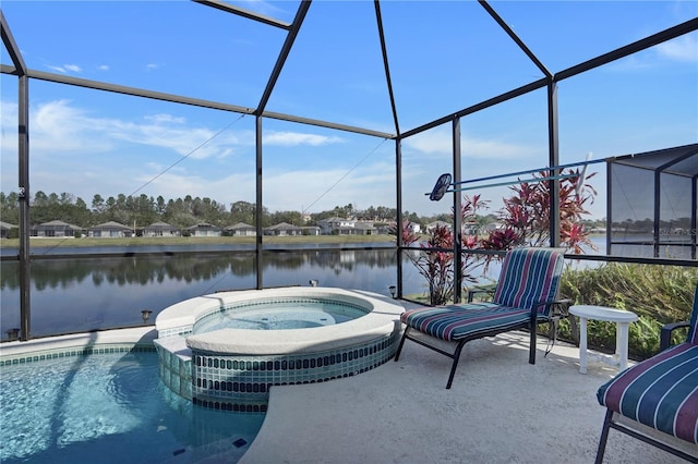 view of swimming pool featuring a patio, a lanai, a water view, and an in ground hot tub