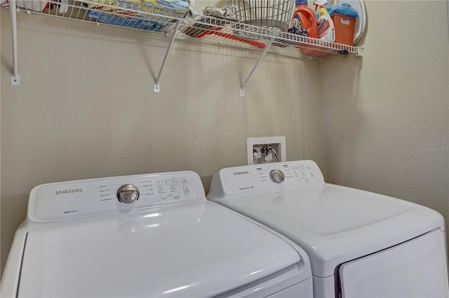 washroom with washer and clothes dryer