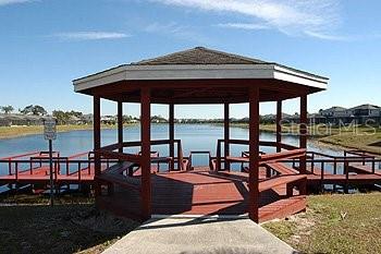 view of dock with a water view and a gazebo